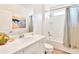 Bright bathroom with a shower-tub combination, white vanity, and modern decor at 537 Marcello Blvd, Kissimmee, FL 34746