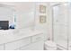 Bright bathroom with a glass shower, modern vanity, and neutral tones for a spa-like ambiance at 537 Marcello Blvd, Kissimmee, FL 34746