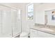 All-white bathroom features a walk-in shower and modern vanity at 537 Marcello Blvd, Kissimmee, FL 34746