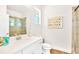 Modern bathroom with a glass shower, white vanity, and contemporary fixtures for a sleek, minimalist design at 537 Marcello Blvd, Kissimmee, FL 34746