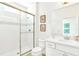 Bright bathroom featuring a glass-enclosed shower, white vanity, and modern fixtures for a clean, contemporary look at 537 Marcello Blvd, Kissimmee, FL 34746