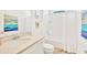 Bright bathroom with a shower-tub combination, white vanity, and stylish decor at 537 Marcello Blvd, Kissimmee, FL 34746