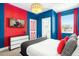 Fun bedroom features a bright color scheme and an adjacent bathroom at 537 Marcello Blvd, Kissimmee, FL 34746