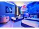 Themed bedroom with twin beds, Star Wars wall art, accent lighting, and comfortable seating at 537 Marcello Blvd, Kissimmee, FL 34746