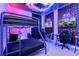 This themed bedroom features bunk beds, gaming stations, and neon lighting at 537 Marcello Blvd, Kissimmee, FL 34746