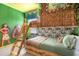 This themed bedroom features custom bunk beds, tropical accents, and fun wall decor at 537 Marcello Blvd, Kissimmee, FL 34746