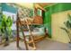 Fun bedroom with a tropical theme, custom bunk beds, and whimsical decor at 537 Marcello Blvd, Kissimmee, FL 34746