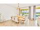 Inviting dining space with view of the pool and lake, ideal for Gathering meals at 537 Marcello Blvd, Kissimmee, FL 34746