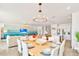 Spacious dining area with seating for eight, open to living room and kitchen at 537 Marcello Blvd, Kissimmee, FL 34746