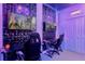 A gaming room featuring textured walls, TVs, and LED lighting for an immersive entertainment experience at 537 Marcello Blvd, Kissimmee, FL 34746