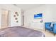 Beautifully decorated main bedroom featuring a TV and an adjacent cozy blue chair at 537 Marcello Blvd, Kissimmee, FL 34746