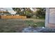 Large backyard, fenced and ready for outdoor activities; offers a blend of open space and privacy at 5711 Riordan Way, Orlando, FL 32808