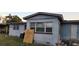Exterior home picture of a spacious backyard, fenced and featuring large windows for natural light at 5711 Riordan Way, Orlando, FL 32808