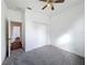 Bedroom featuring a closet, neutral walls, ceiling fan and gray carpeting at 603 Deauville Ct, Kissimmee, FL 34758