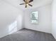 Bright bedroom with a ceiling fan and natural light from the window at 603 Deauville Ct, Kissimmee, FL 34758