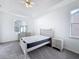 Bright bedroom features neutral decor, tray ceiling, and a ceiling fan at 603 Deauville Ct, Kissimmee, FL 34758