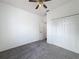 Bedroom featuring a closet, neutral walls, ceiling fan and gray carpeting at 603 Deauville Ct, Kissimmee, FL 34758