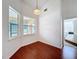 Breakfast nook with hardwood floors, hanging light fixture and large windows at 603 Deauville Ct, Kissimmee, FL 34758