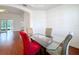 Dining area with seating for four and glass table at 603 Deauville Ct, Kissimmee, FL 34758