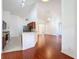 Open concept living room with hardwood floors and vaulted ceilings at 603 Deauville Ct, Kissimmee, FL 34758