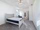 Spacious main bedroom with tray ceiling, ceiling fan, and neutral color scheme at 603 Deauville Ct, Kissimmee, FL 34758