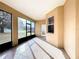 Screened patio with tile flooring, featuring access doors and view of the backyard at 603 Deauville Ct, Kissimmee, FL 34758