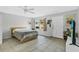 Bedroom with tile floor, neutral walls, and a ceiling fan at 627 N Hyer Ave, Orlando, FL 32803