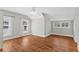Bright bedroom with hardwood floors, ceiling fan, and natural light at 627 N Hyer Ave, Orlando, FL 32803