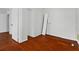 Bedroom featuring hardwood floors, closet, and utility hookups at 627 N Hyer Ave, Orlando, FL 32803