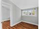 Bedroom with wood floors, window and natural light at 627 N Hyer Ave, Orlando, FL 32803