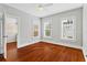 Bedroom features hardwood floors and natural light at 627 N Hyer Ave, Orlando, FL 32803
