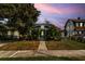 Charming home featuring mature trees, lush landscaping, and a welcoming front entrance on a spacious lot at 627 N Hyer Ave, Orlando, FL 32803