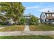Charming home featuring tropical landscaping and inviting curb appeal at 627 N Hyer Ave, Orlando, FL 32803