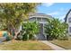 Charming home with a well-maintained front yard and a bright blue front door at 627 N Hyer Ave, Orlando, FL 32803
