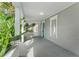 Inviting front porch with white railings and a vibrant blue front door at 627 N Hyer Ave, Orlando, FL 32803
