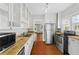 Bright kitchen with stainless steel appliances and butcher block countertops at 627 N Hyer Ave, Orlando, FL 32803