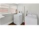 Laundry room with washer, dryer and ample natural light at 627 N Hyer Ave, Orlando, FL 32803