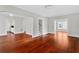 Spacious living room with gleaming hardwood floors and ample natural light at 627 N Hyer Ave, Orlando, FL 32803