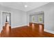 Bright and open living room featuring hardwood floors and stylish archways at 627 N Hyer Ave, Orlando, FL 32803