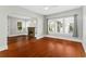 Living room featuring hardwood floors, fireplace, and multiple windows at 627 N Hyer Ave, Orlando, FL 32803