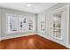 Sunroom features natural light and hardwood floors at 627 N Hyer Ave, Orlando, FL 32803