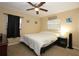 Bedroom features carpet flooring, ceiling fan, and lots of natural light at 7119 Leighton Way, Orlando, FL 32822