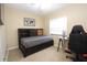 Cozy bedroom features a built-in bed frame, neutral color, and lots of natural light at 7119 Leighton Way, Orlando, FL 32822