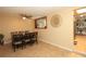 Open dining space featuring a table with seating for six and a decorative mirror at 7119 Leighton Way, Orlando, FL 32822