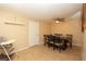 Simple dining area with a dark wood table, six chairs, and tiled floors at 7119 Leighton Way, Orlando, FL 32822