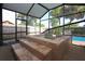 Enclosed hot tub area with stone steps, privacy screens and lush landscaping at 7119 Leighton Way, Orlando, FL 32822