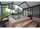 View of a hot tub, privacy screens and a view to pool at 7119 Leighton Way, Orlando, FL 32822