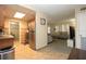 Open-concept kitchen with modern appliances, ample counter space, and a view into the living area at 7119 Leighton Way, Orlando, FL 32822