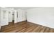 Bright bedroom features modern wood-look flooring and neutral walls at 721 Polo Park Blvd, Davenport, FL 33897