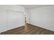 Minimalist bedroom featuring wood floors and closet space at 721 Polo Park Blvd, Davenport, FL 33897